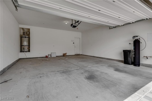 4448 Mahogany Hills Ave, Las Vegas, NV 89141 - garage with water heater, a garage door opener, and baseboards