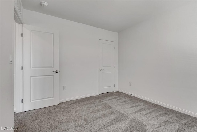 4448 Mahogany Hills Ave, Las Vegas, NV 89141 - spare room featuring carpet floors, a smoke detector, and baseboards