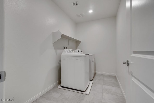4448 Mahogany Hills Ave, Las Vegas, NV 89141 - laundry area featuring washer and dryer, baseboards, and light tile patterned floors