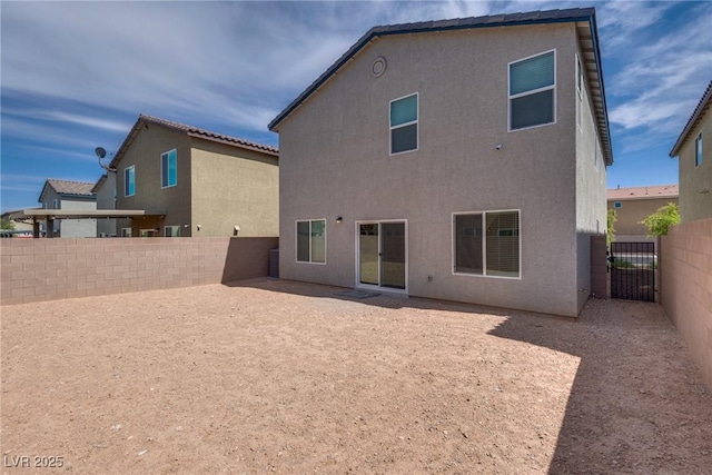 4448 Mahogany Hills Ave, Las Vegas, NV 89141 - back of property featuring a fenced backyard and stucco siding