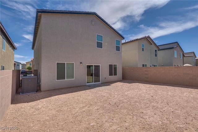 4448 Mahogany Hills Ave, Las Vegas, NV 89141 - back of property featuring central AC unit, stucco siding, and a fenced backyard