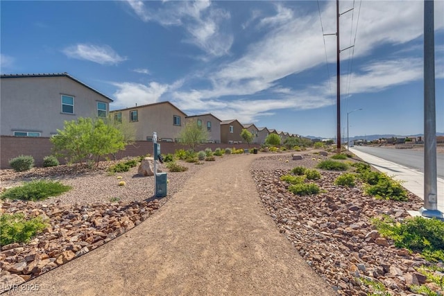 4448 Mahogany Hills Ave, Las Vegas, NV 89141 - view of asphalt road with street lighting and a residential view