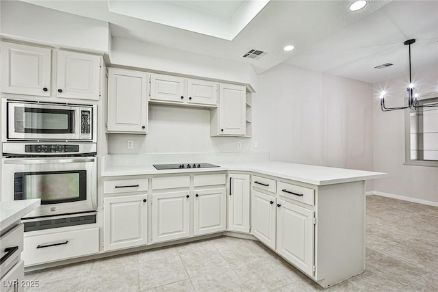 5316 Fieldstone Rd, Las Vegas, NV 89107 - kitchen with stainless steel appliances, light countertops, a peninsula, white cabinetry, and recessed lighting