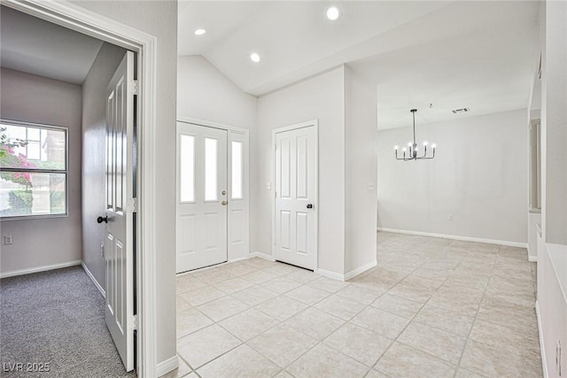 5316 Fieldstone Rd, Las Vegas, NV 89107 - entryway with a chandelier, light tile patterned flooring, recessed lighting, vaulted ceiling, and baseboards