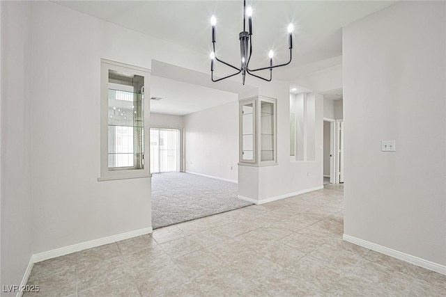 5316 Fieldstone Rd, Las Vegas, NV 89107 - unfurnished room featuring a chandelier, baseboards, light colored carpet, and light tile patterned floors