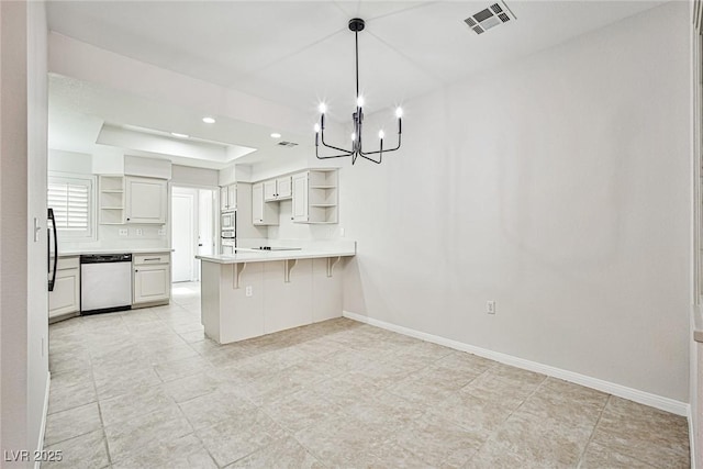 5316 Fieldstone Rd, Las Vegas, NV 89107 - kitchen with open shelves, stainless steel dishwasher, a peninsula, a tray ceiling, and recessed lighting