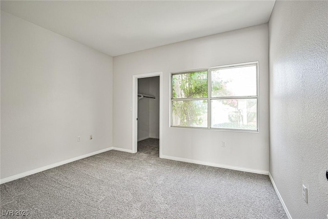 5316 Fieldstone Rd, Las Vegas, NV 89107 - unfurnished bedroom featuring carpet floors, baseboards, a walk in closet, and a closet