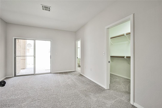 5316 Fieldstone Rd, Las Vegas, NV 89107 - unfurnished bedroom with carpet, a walk in closet, and baseboards