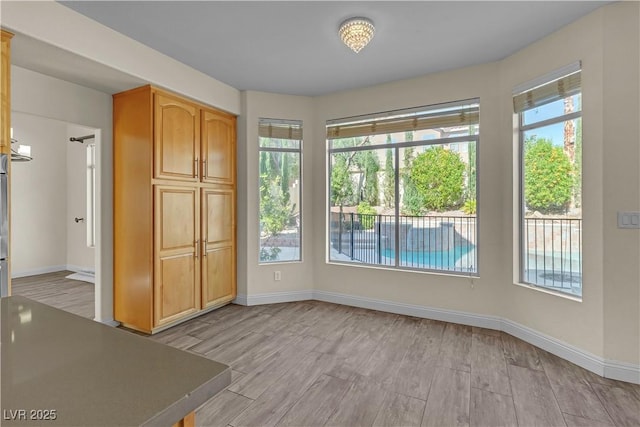 1717 Double Arch Ct, Las Vegas, NV 89128 - spare room with baseboards and light wood-style floors