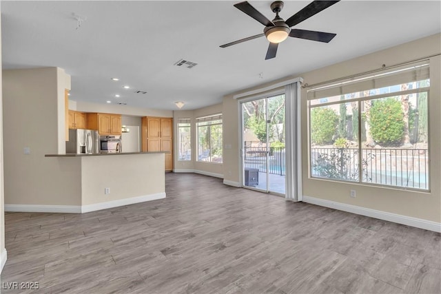 1717 Double Arch Ct, Las Vegas, NV 89128 - unfurnished living room featuring recessed lighting, a ceiling fan, and light wood finished floors