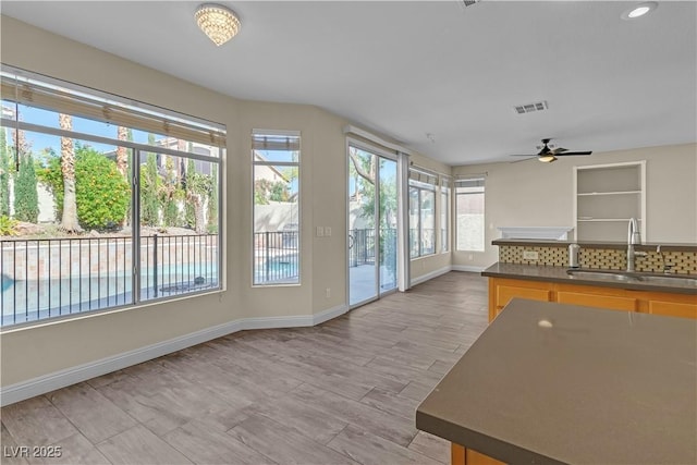 1717 Double Arch Ct, Las Vegas, NV 89128 - unfurnished sunroom with a sink and recessed lighting