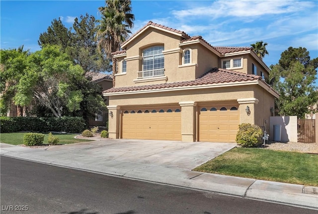 1717 Double Arch Ct, Las Vegas, NV 89128 - mediterranean / spanish-style home featuring stucco siding, concrete driveway, a tile roof, and a garage