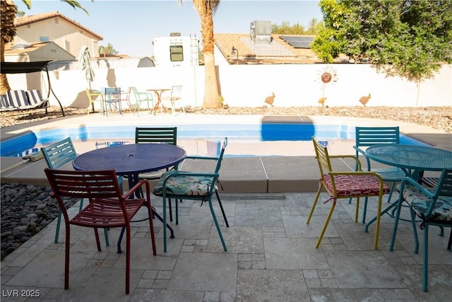 3436 N Tenaya Way, Las Vegas, NV 89129 - view of swimming pool with outdoor dining space, a fenced backyard, and a patio area