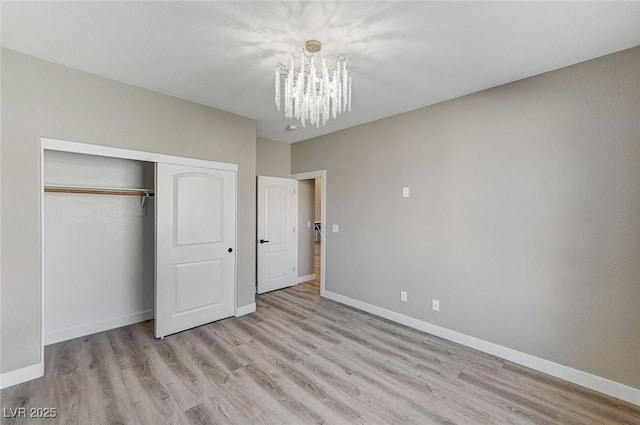 2714 Langlade Ave, Henderson, NV 89052 - unfurnished bedroom featuring a chandelier, wood finished floors, and a closet
