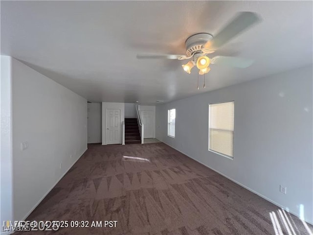 7464 Edgecove Ct, Las Vegas, NV 89139 - unfurnished living room featuring carpet floors, a ceiling fan, and stairs