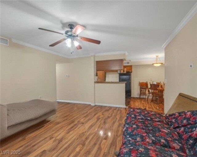 3135 S Mojave Rd Unit 113, Las Vegas, NV 89121 - living area featuring ornamental molding, wood finished floors, and ceiling fan