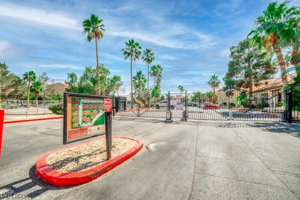 3135 S Mojave Rd Unit 113, Las Vegas, NV 89121 - view of concrete road with a gate, a gated entry, and curbs
