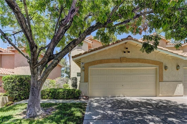 108 Broken Rock Dr, Henderson, NV 89074 - view of front facade with stucco siding, driveway, and a garage