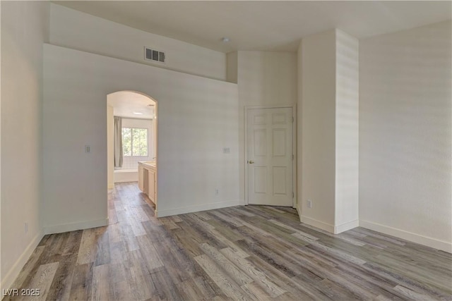 108 Broken Rock Dr, Henderson, NV 89074 - spare room with arched walkways and wood finished floors