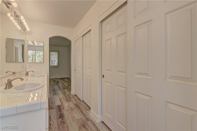 108 Broken Rock Dr, Henderson, NV 89074 - bathroom with double vanity, a closet, and wood finished floors