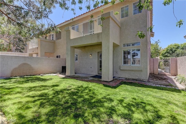 108 Broken Rock Dr, Henderson, NV 89074 - rear view of property featuring stucco siding and a gate