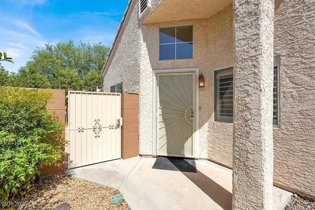 3053 Anchor Chain Dr, Las Vegas, NV 89128 - doorway to property with stucco siding and a gate