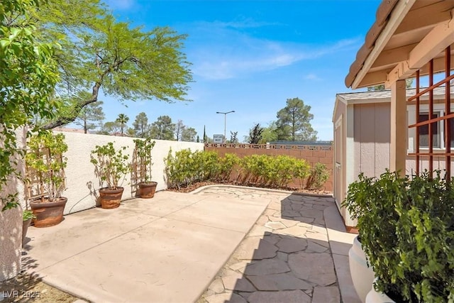 3053 Anchor Chain Dr, Las Vegas, NV 89128 - fenced backyard with a patio area