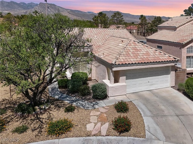 3053 Anchor Chain Dr, Las Vegas, NV 89128 - view of front of house with a tile roof, driveway, a mountain view, and a garage