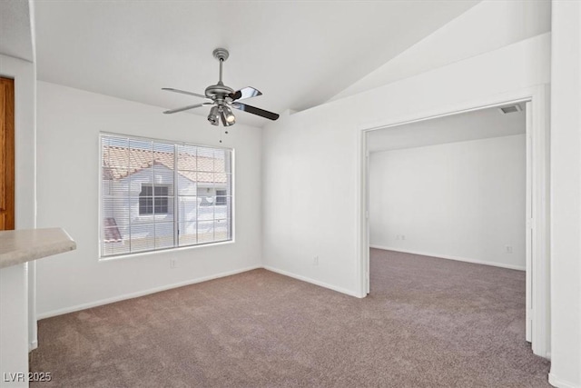 5201 S Torrey Pines Dr Unit 1221, Las Vegas, NV 89118 - empty room with carpet flooring, vaulted ceiling, a ceiling fan, and baseboards