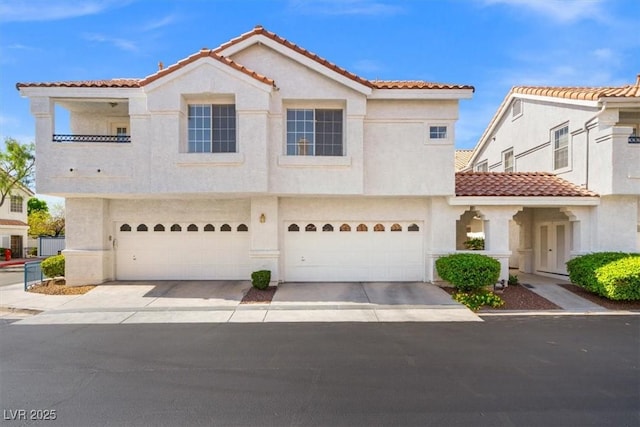 5201 S Torrey Pines Dr Unit 1221, Las Vegas, NV 89118 - mediterranean / spanish-style house featuring a tiled roof, stucco siding, and an attached garage
