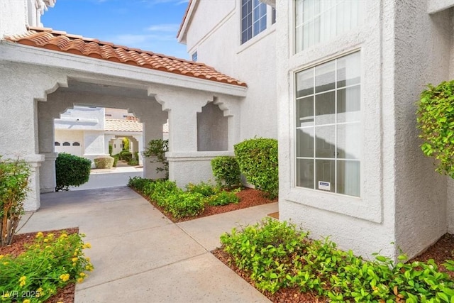5201 S Torrey Pines Dr Unit 1221, Las Vegas, NV 89118 - doorway to property featuring stucco siding and a tiled roof