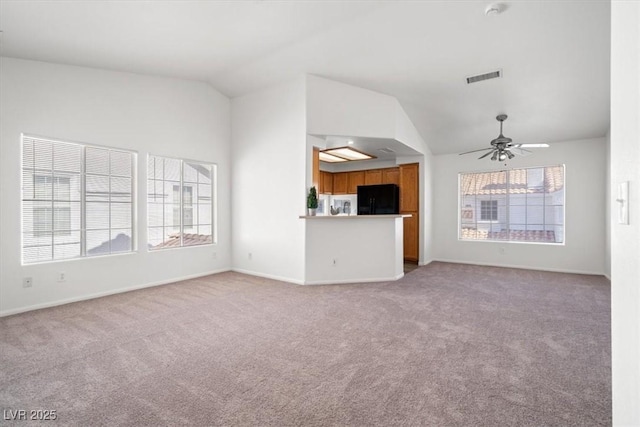 5201 S Torrey Pines Dr Unit 1221, Las Vegas, NV 89118 - unfurnished living room with vaulted ceiling, light colored carpet, baseboards, and ceiling fan