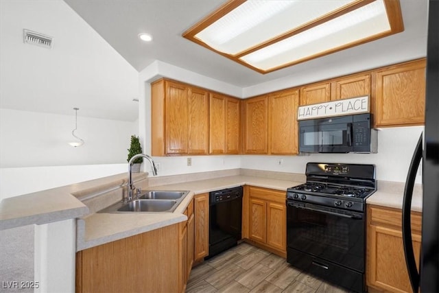 5201 S Torrey Pines Dr Unit 1221, Las Vegas, NV 89118 - kitchen with black appliances, a sink, a peninsula, light wood-style flooring, and light countertops