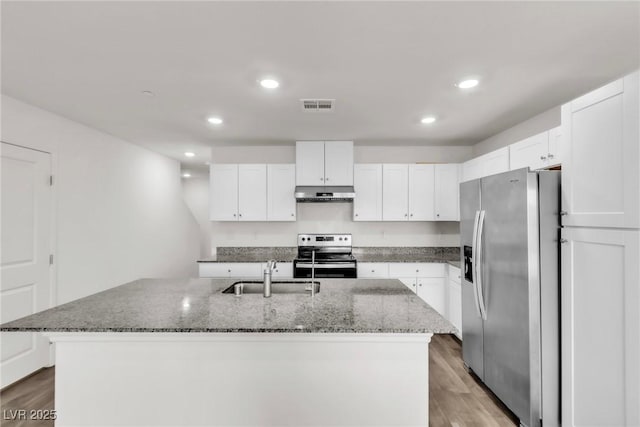 7977 Whisper Words Ave, Las Vegas, NV 89113 - kitchen featuring appliances with stainless steel finishes, a sink, under cabinet range hood, dark stone counters, and recessed lighting