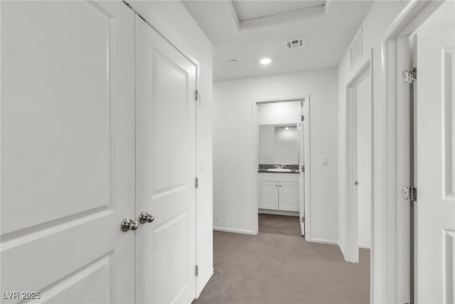 7977 Whisper Words Ave, Las Vegas, NV 89113 - hall featuring light carpet, baseboards, and recessed lighting