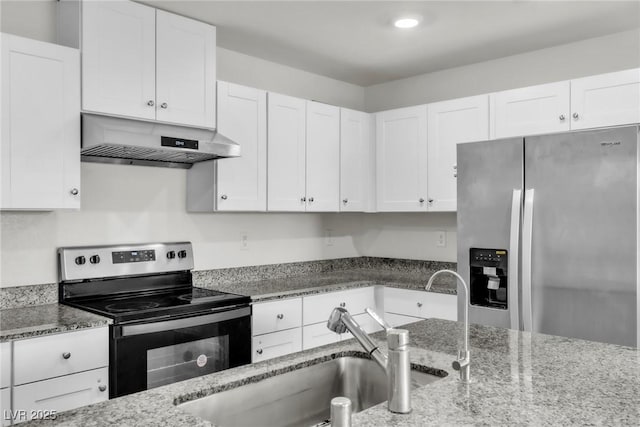 7977 Whisper Words Ave, Las Vegas, NV 89113 - kitchen with stainless steel appliances, extractor fan, a sink, light stone countertops, and white cabinets