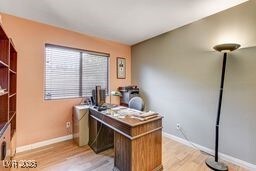 6143 Basilone Ave, Las Vegas, NV 89122 - home office with baseboards and light wood finished floors