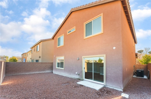1512 Groom Ave, North Las Vegas, NV 89081 - rear view of property with a fenced backyard, stucco siding, and cooling unit