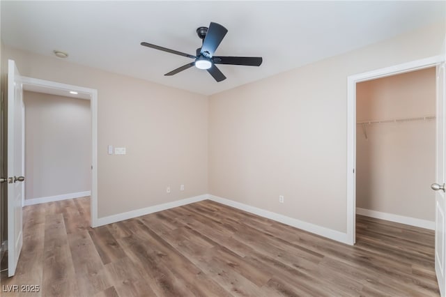1512 Groom Ave, North Las Vegas, NV 89081 - unfurnished bedroom with wood finished floors, a closet, and baseboards
