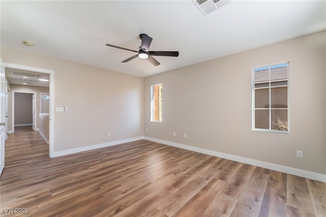 1512 Groom Ave, North Las Vegas, NV 89081 - empty room featuring baseboards, wood finished floors, ceiling fan, and a smoke detector