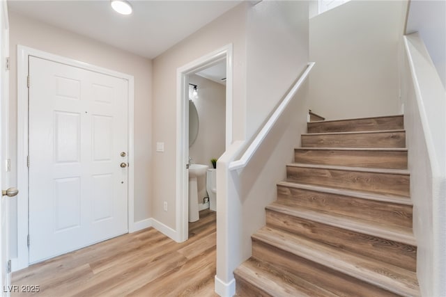 1512 Groom Ave, North Las Vegas, NV 89081 - entrance foyer featuring light wood-style flooring, stairs, and baseboards