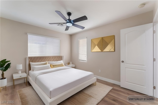 1512 Groom Ave, North Las Vegas, NV 89081 - bedroom with light wood-style floors, baseboards, and ceiling fan
