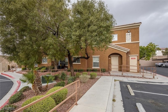 10291 Delta View Ct Unit 101, Las Vegas, NV 89129 - view of building exterior with uncovered parking