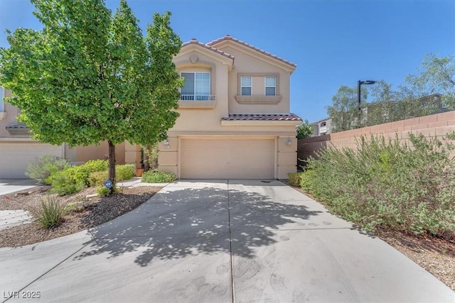 6247 Sugartree Ave, Las Vegas, NV 89141 - view of front of property with driveway, stucco siding, a tile roof, and an attached garage