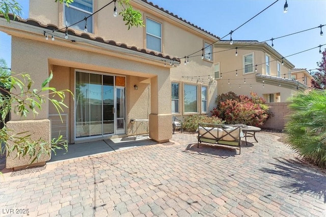 6247 Sugartree Ave, Las Vegas, NV 89141 - rear view of house with a patio area, stucco siding, and a tiled roof