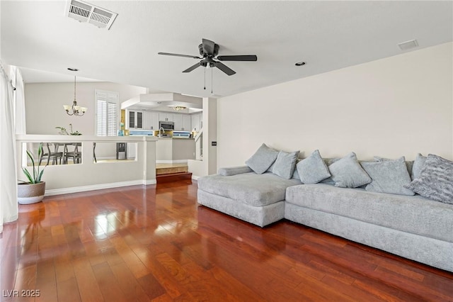 2080 Silver Breeze Ave, Las Vegas, NV 89183 - living area with a chandelier, a ceiling fan, wood finished floors, and baseboards