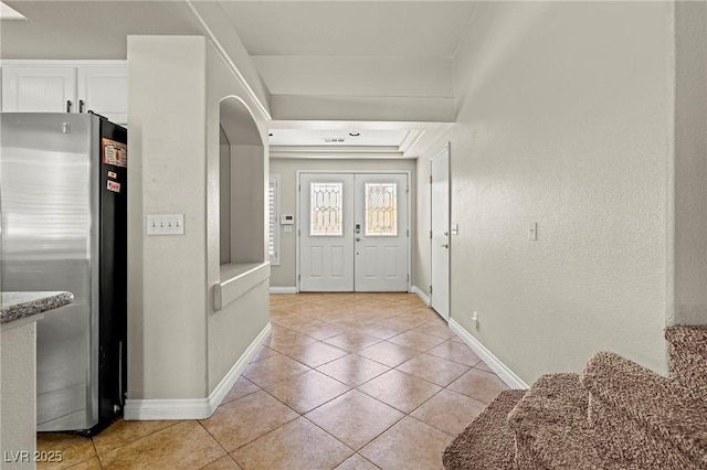 2080 Silver Breeze Ave, Las Vegas, NV 89183 - foyer entrance featuring light tile patterned floors, baseboards, and arched walkways