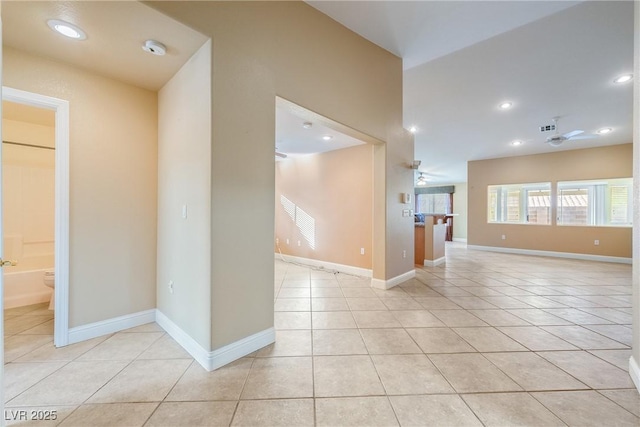 11082 Sospel Pl, Las Vegas, NV 89141 - empty room featuring light tile patterned flooring, a ceiling fan, baseboards, a smoke detector, and recessed lighting