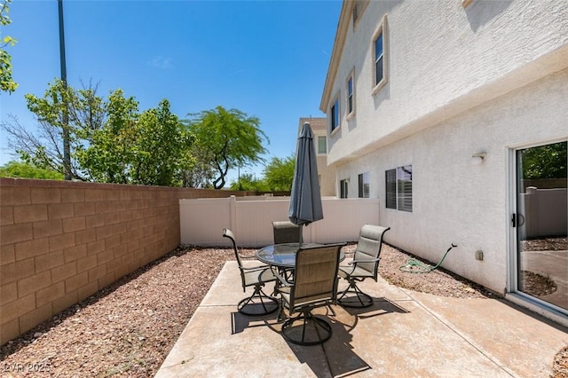 9362 Straw Hays St Unit 103, Las Vegas, NV 89178 - fenced backyard featuring a patio and outdoor dining space