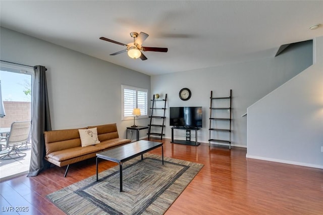 9362 Straw Hays St Unit 103, Las Vegas, NV 89178 - living area with healthy amount of natural light, a ceiling fan, wood finished floors, and baseboards